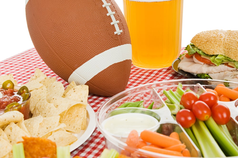 Veggie platter surrounded by Super Bowl decor 